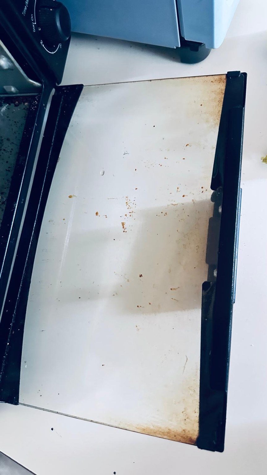 Oven door glass before cleaning